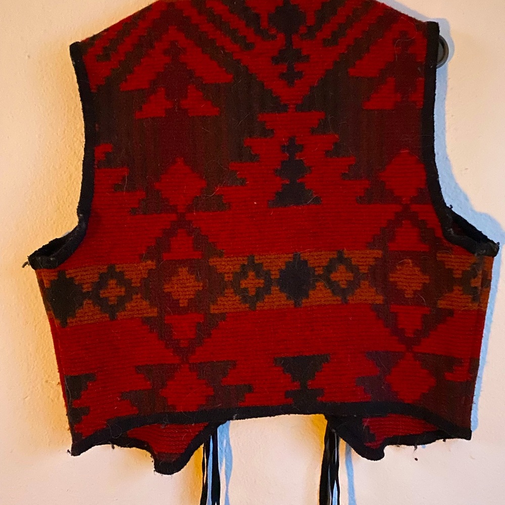 Wool rich wool vest missing 1 concho in photo but will put back on if sold.